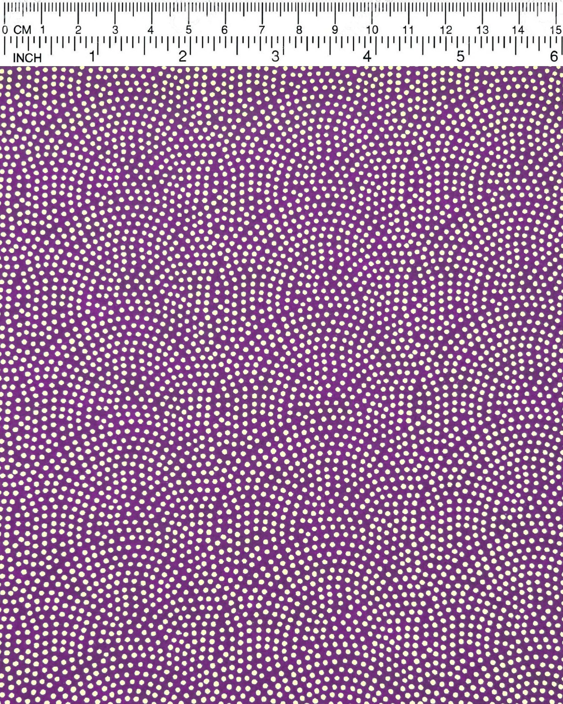 Japanese chiyogami paper featuring a metallic gold "same komon" (sharkskin) design on a dark purple background.