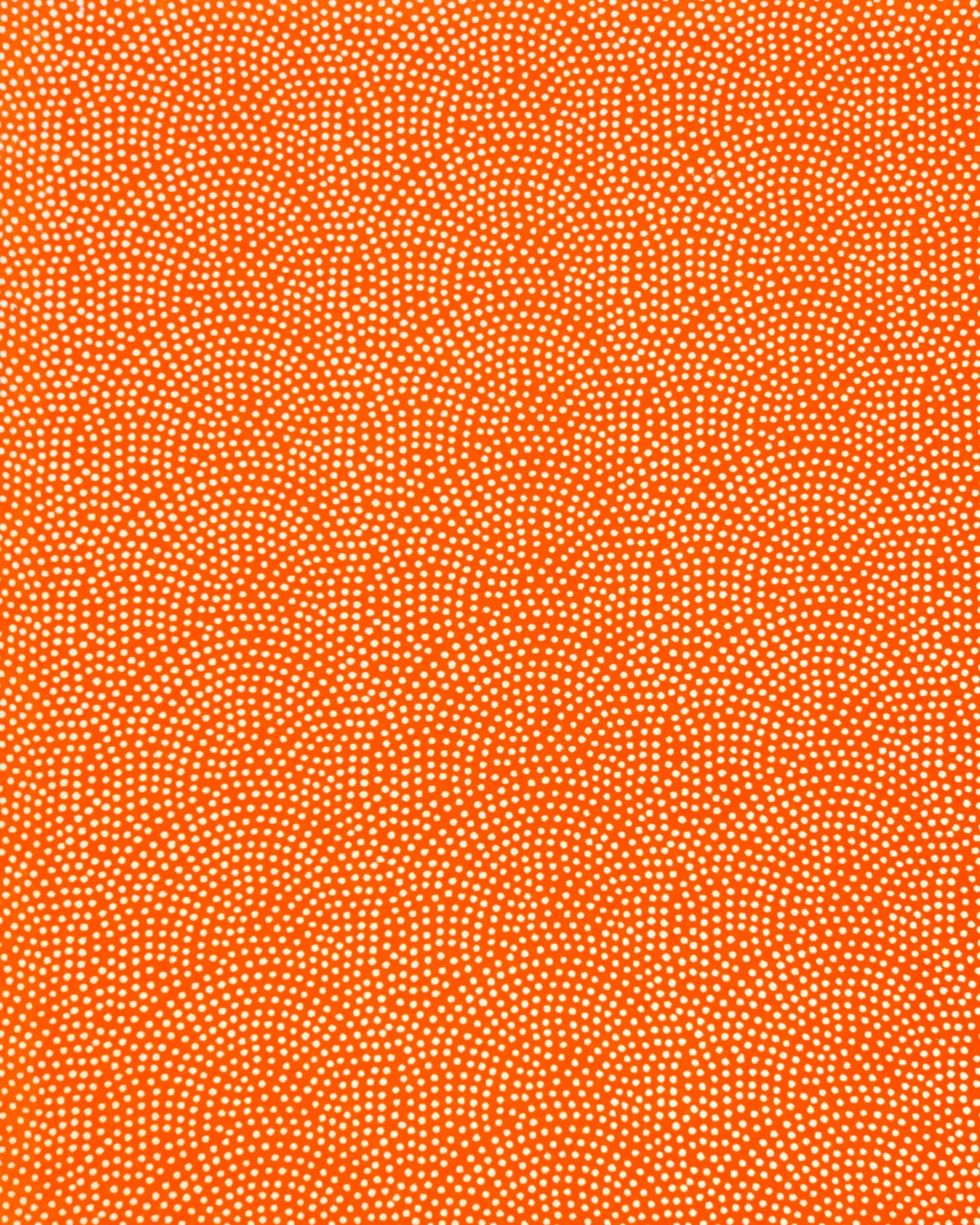 Japanese chiyogami paper featuring a metallic gold "same komon" (sharkskin) design on an orange background.
