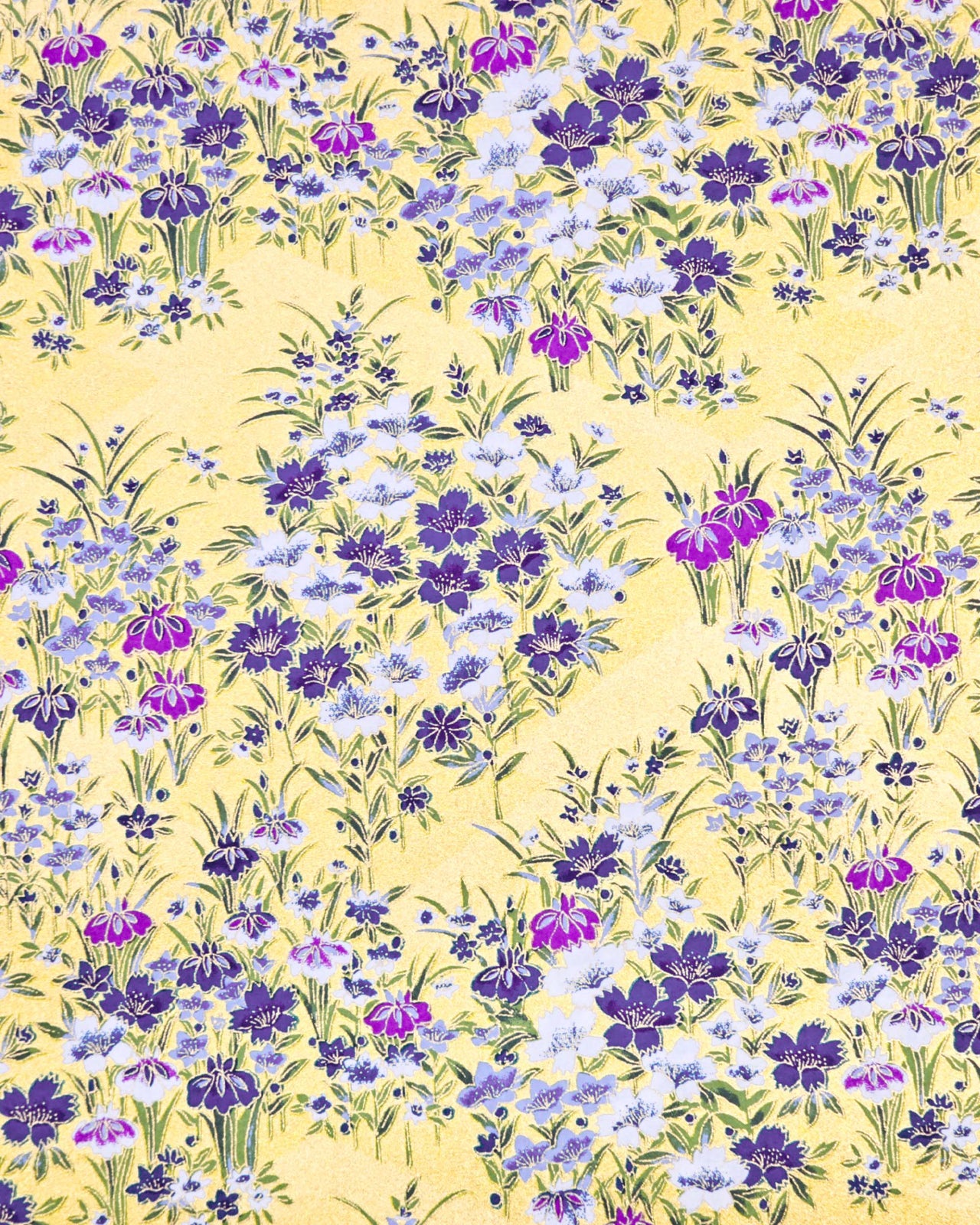 Japanese chiyogami paper featuring blue, purple, and white irises on a gold background with metallic gold accents.
