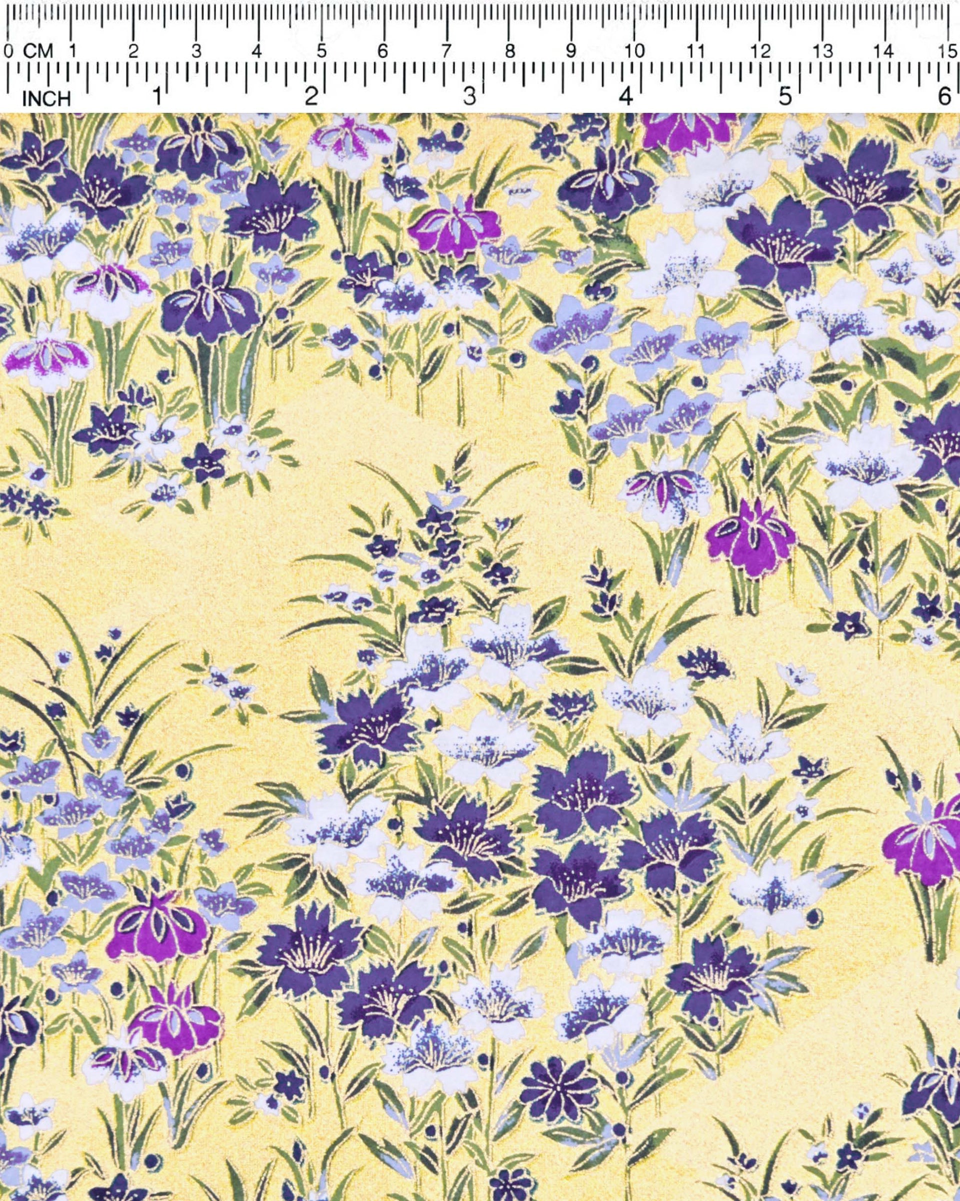 Japanese chiyogami paper featuring blue, purple, and white irises on a gold background with metallic gold accents.