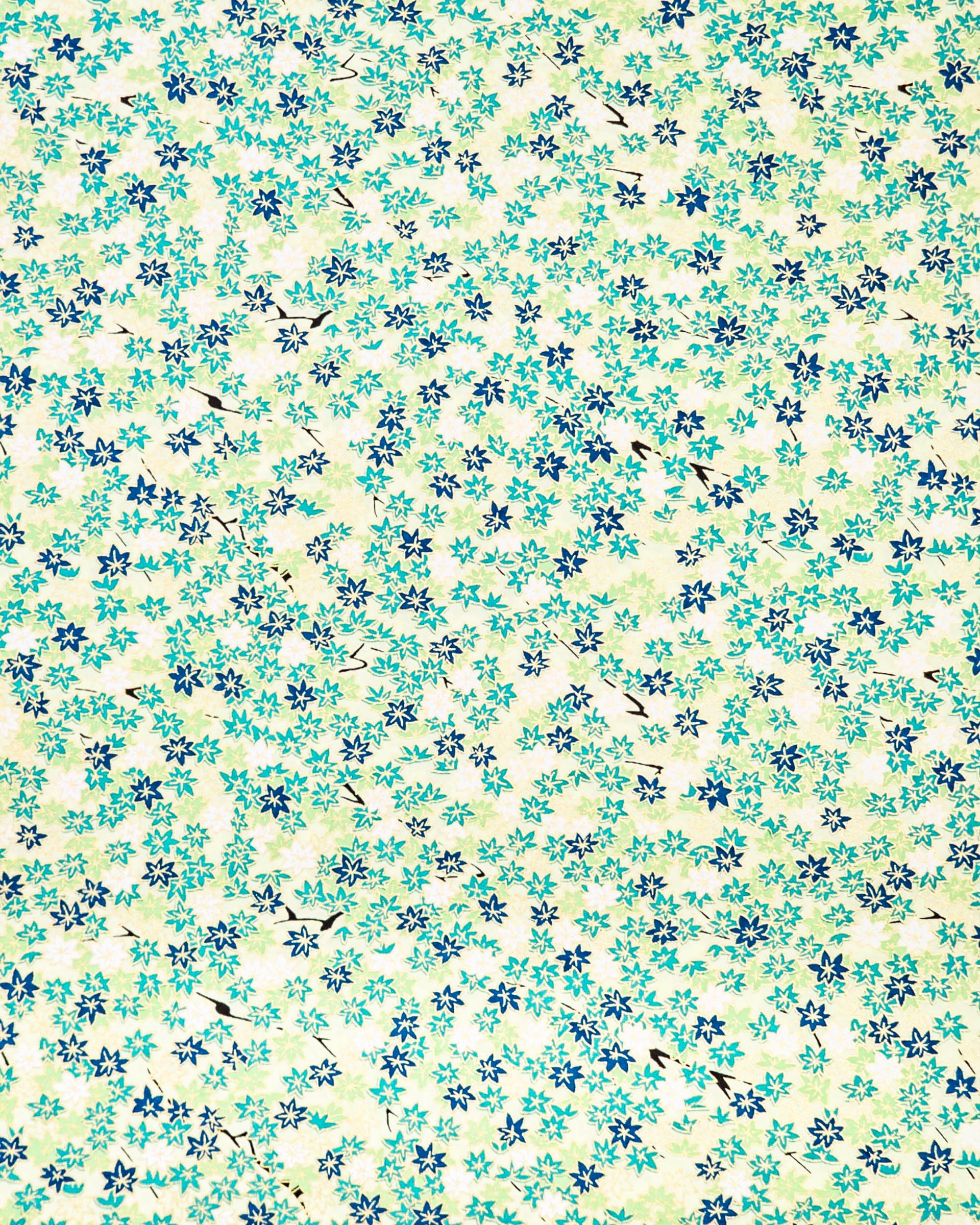 Japanese chiyogami paper featuring small green and white momiji (maple leaves) on a light green background with metallic gold details.