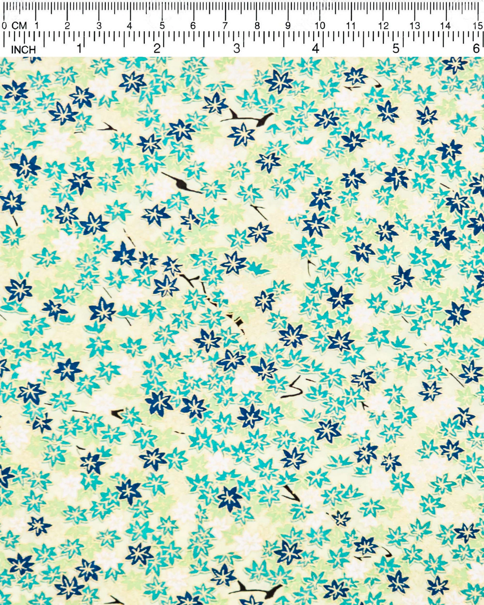 Japanese chiyogami paper featuring small green and white momiji (maple leaves) on a light green background with metallic gold details.