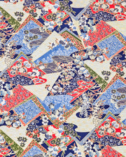 Japanese chiyogami paper featuring red, blue, off white, and green patches adorned with an assortment of various floral and geometric patterns with metallic gold details.