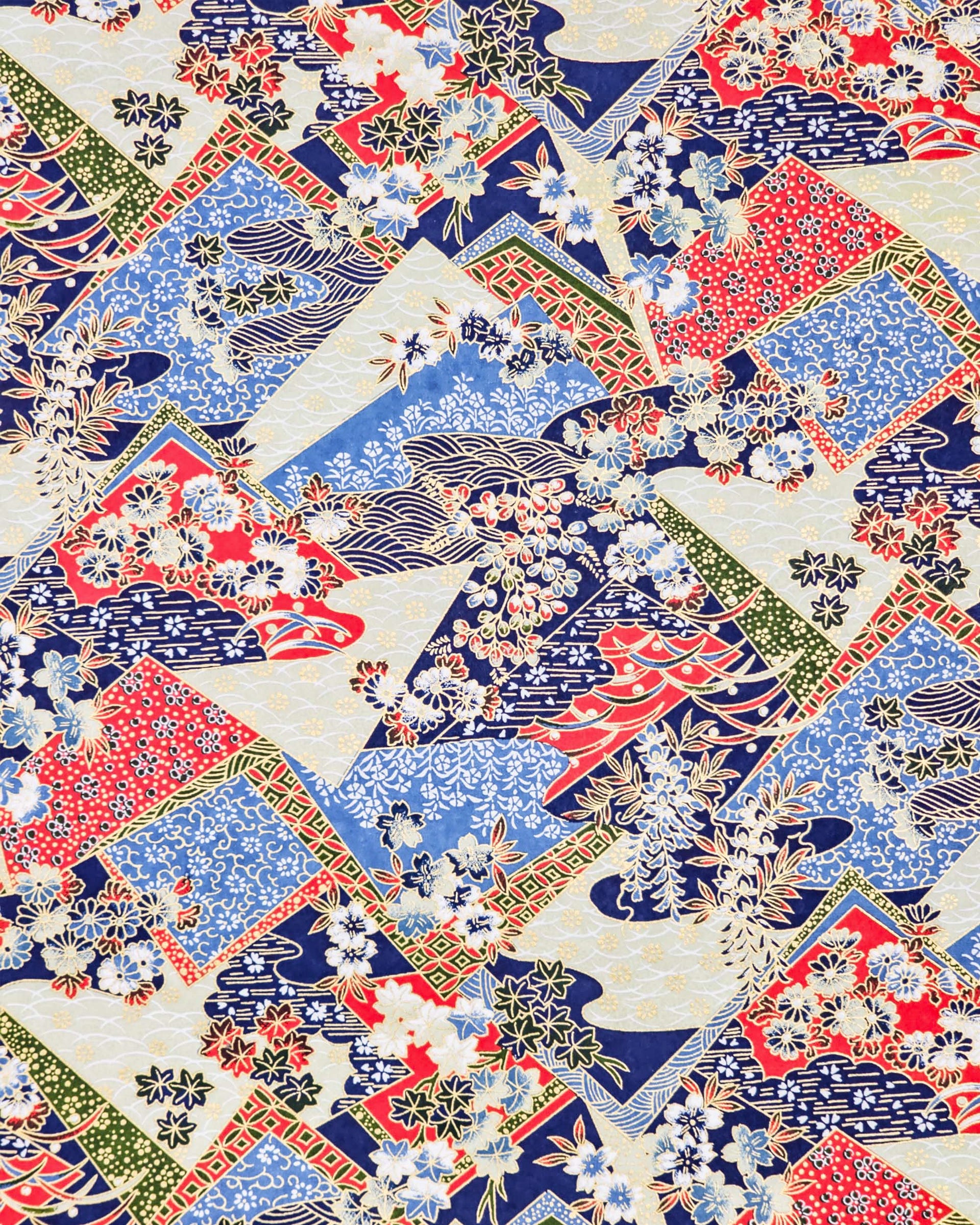 Japanese chiyogami paper featuring red, blue, off white, and green patches adorned with an assortment of various floral and geometric patterns with metallic gold details.