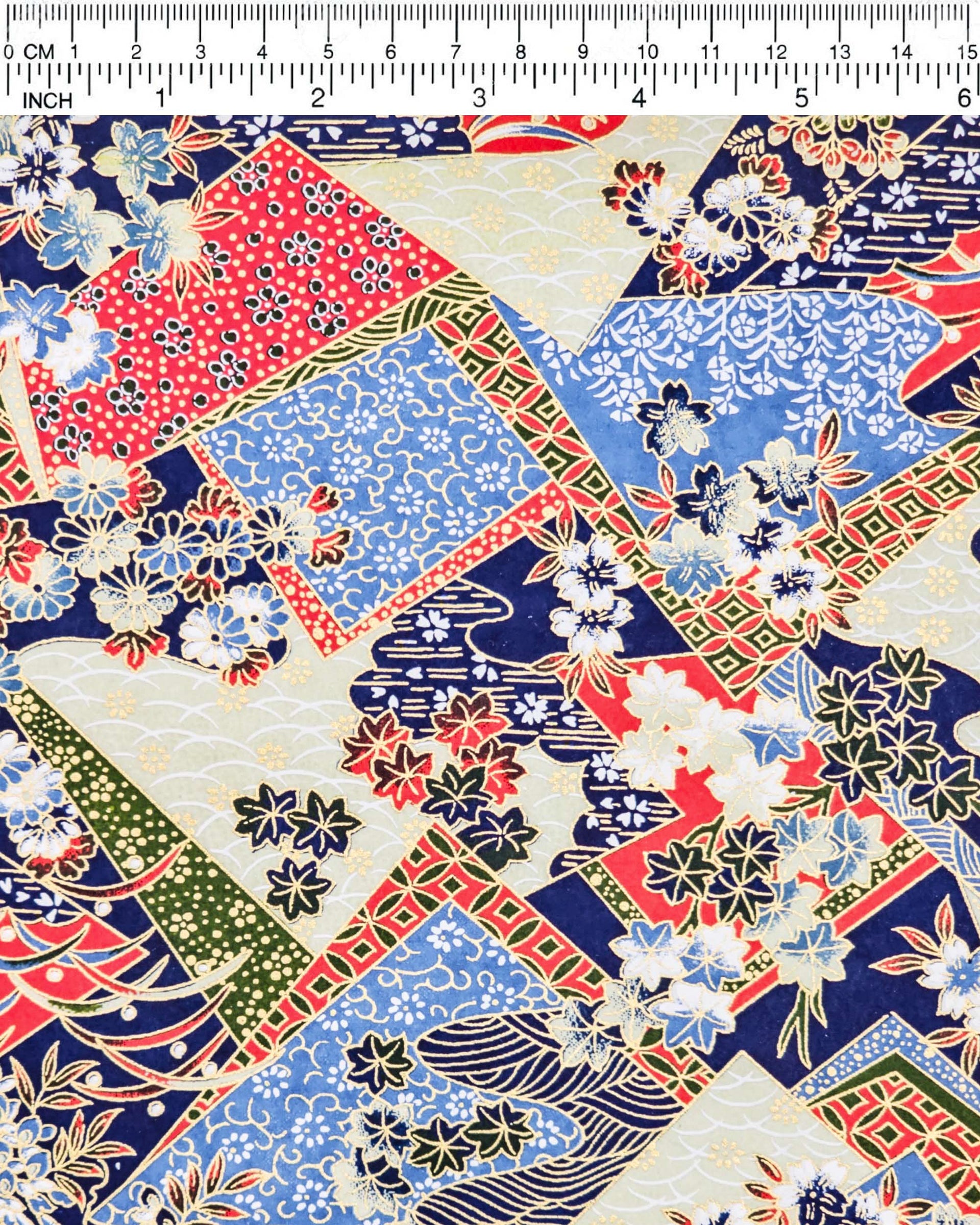 Japanese chiyogami paper featuring red, blue, off white, and green patches adorned with an assortment of various floral and geometric patterns with metallic gold details.