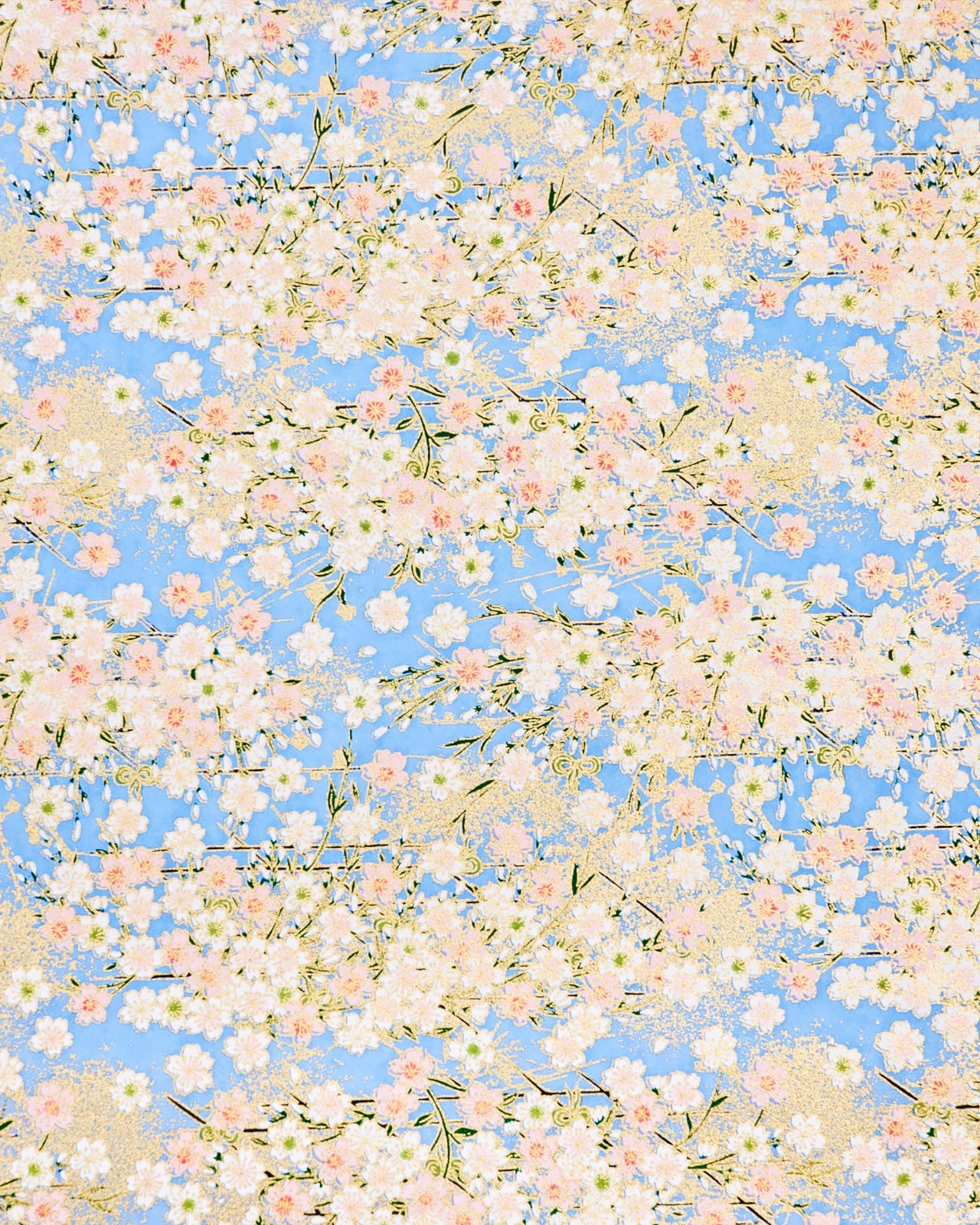 Japanese chiyogami paper featuring light pink and white cherry blossoms on a sky blue background with metallic gold details.