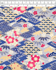 Japanese chiyogami paper featuring large pearlescent magenta pink and white plum blossoms, blue and gold bamboo leaves, and light blue and gold pine on a blue and gold background with metallic gold accents. The background is adorned with a various traditional Japanese geometric designs.