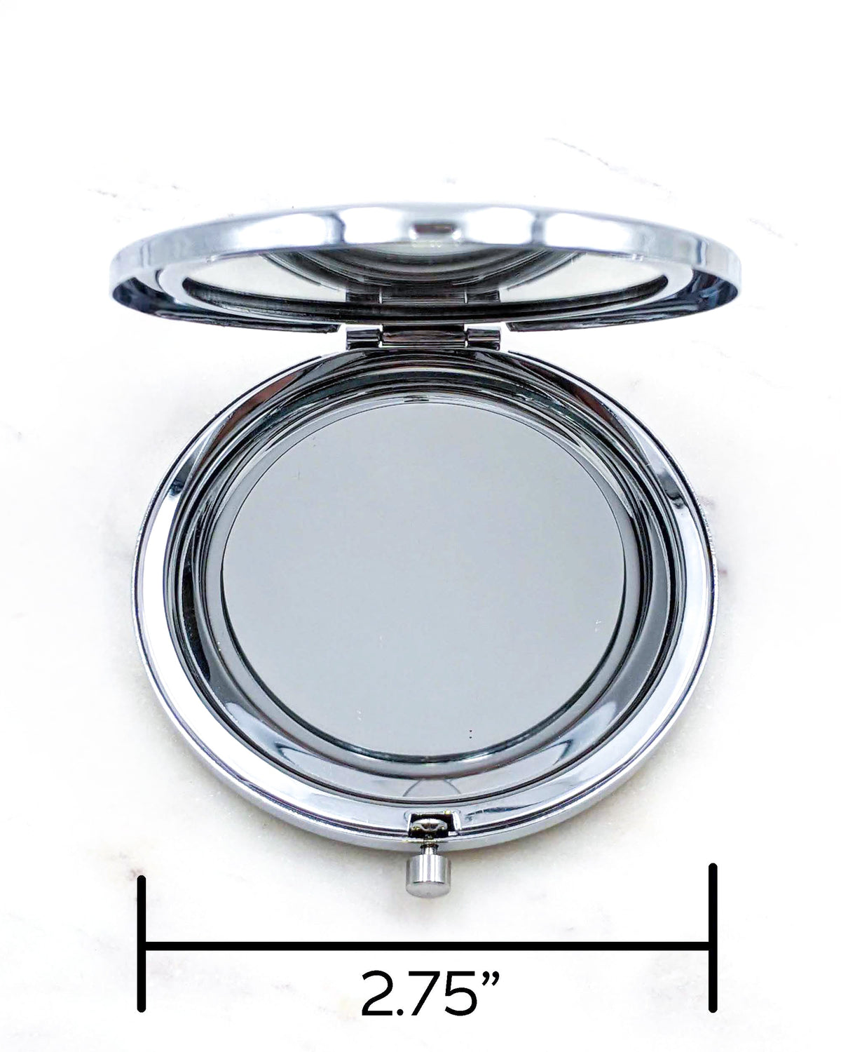 Opened round silver compact mirror showing the size as 2.75"