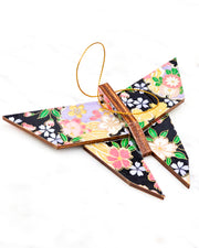 Large wooden origami butterfly ornament featuring pink, yellow, purple, and white cherry blossoms and purple yukiwa on a black background with metallic gold details.