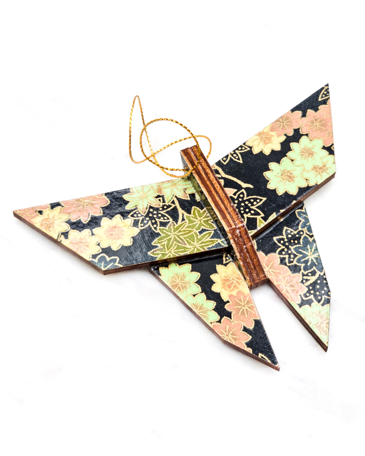 Large wooden origami butterfly ornament featuring assorted green, pink, beige, and gray maple leaves with dark gray and metallic gold dotted maple leaves on a dark gray background.