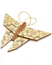 Large wooden origami butterfly ornament featuring black pointillistic plum blossoms on a metallic gold background.