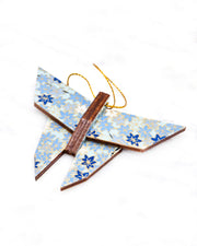 Small wooden origami butterfly ornament featuring small blue and white momiji (maple leaves) on a light blue background with metallic gold details.