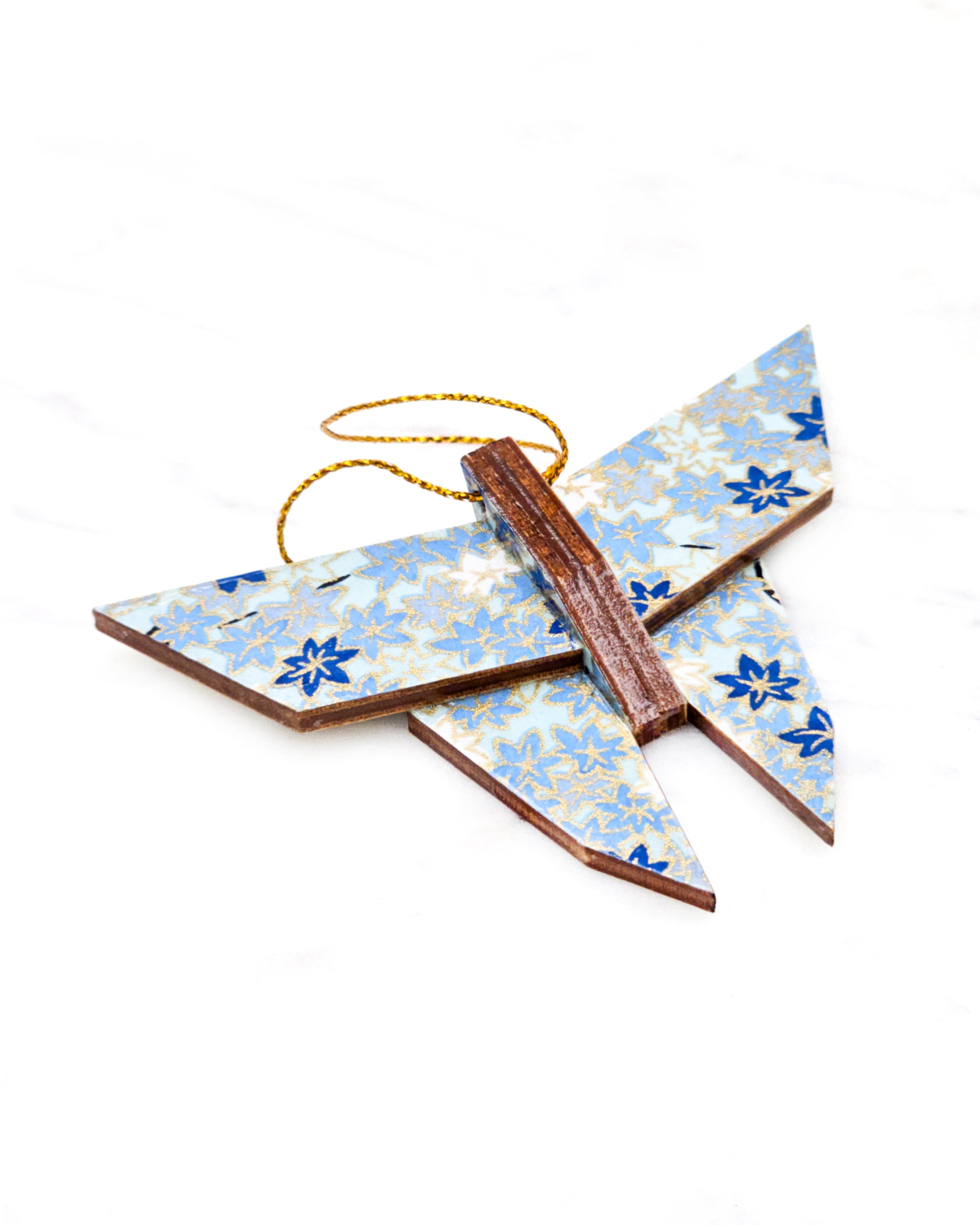 Small wooden origami butterfly ornament featuring small blue and white momiji (maple leaves) on a light blue background with metallic gold details.