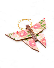 Small wooden origami butterfly ornament featuring pink, white, and red chrysanthemums with green leaves on a pink background with metallic gold accents.