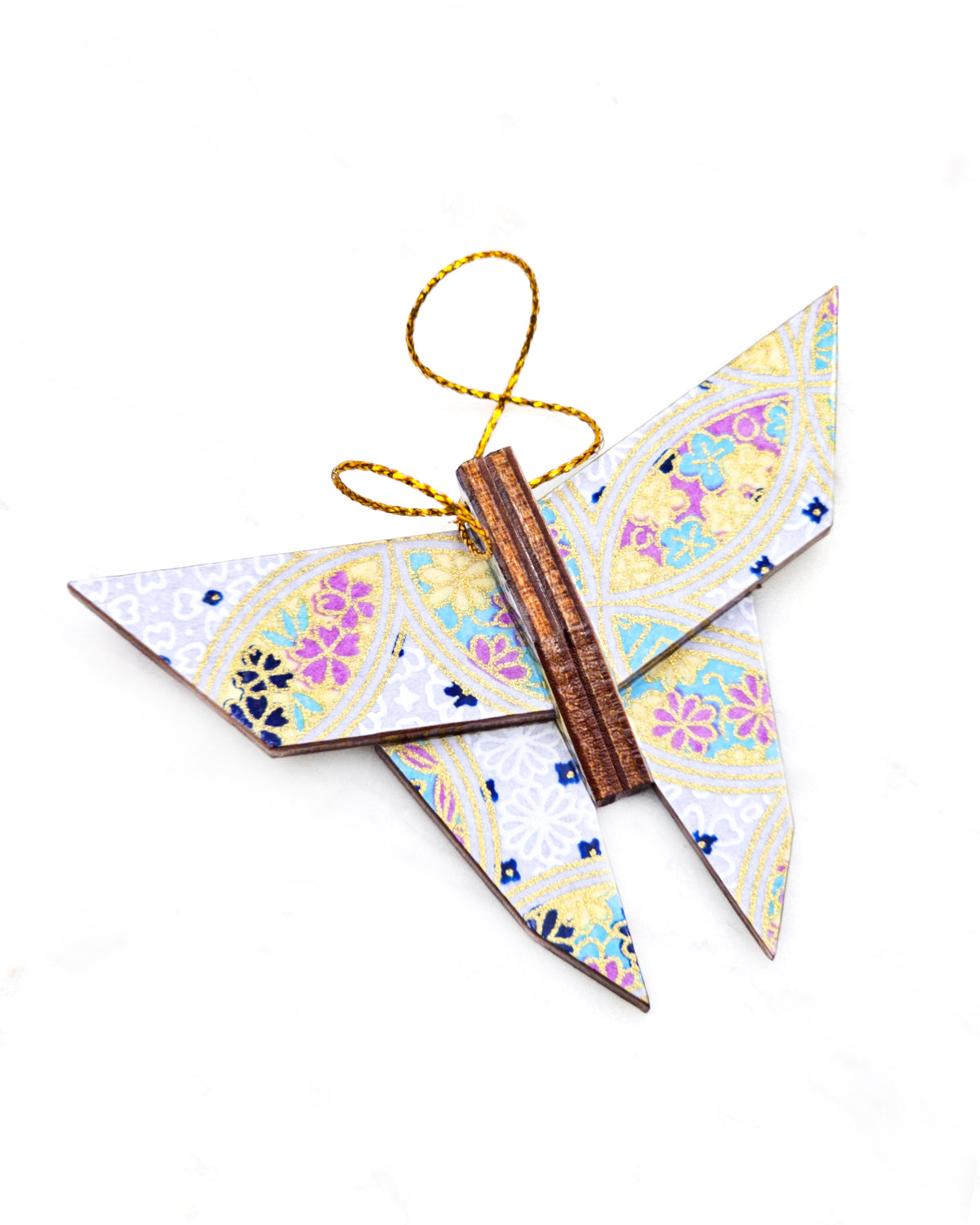 Small wooden origami butterfly ornament featuring a blue, yellow, and purple shippo design filled with assorted floral and geometric designs on a light purple background with metallic gold details.