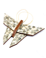 Wooden origami butterfly ornament featuring gray and white maple leaves on a gray background with metallic gold accents.