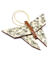 Wooden origami butterfly ornament featuring gray and white maple leaves on a gray background with metallic gold accents.