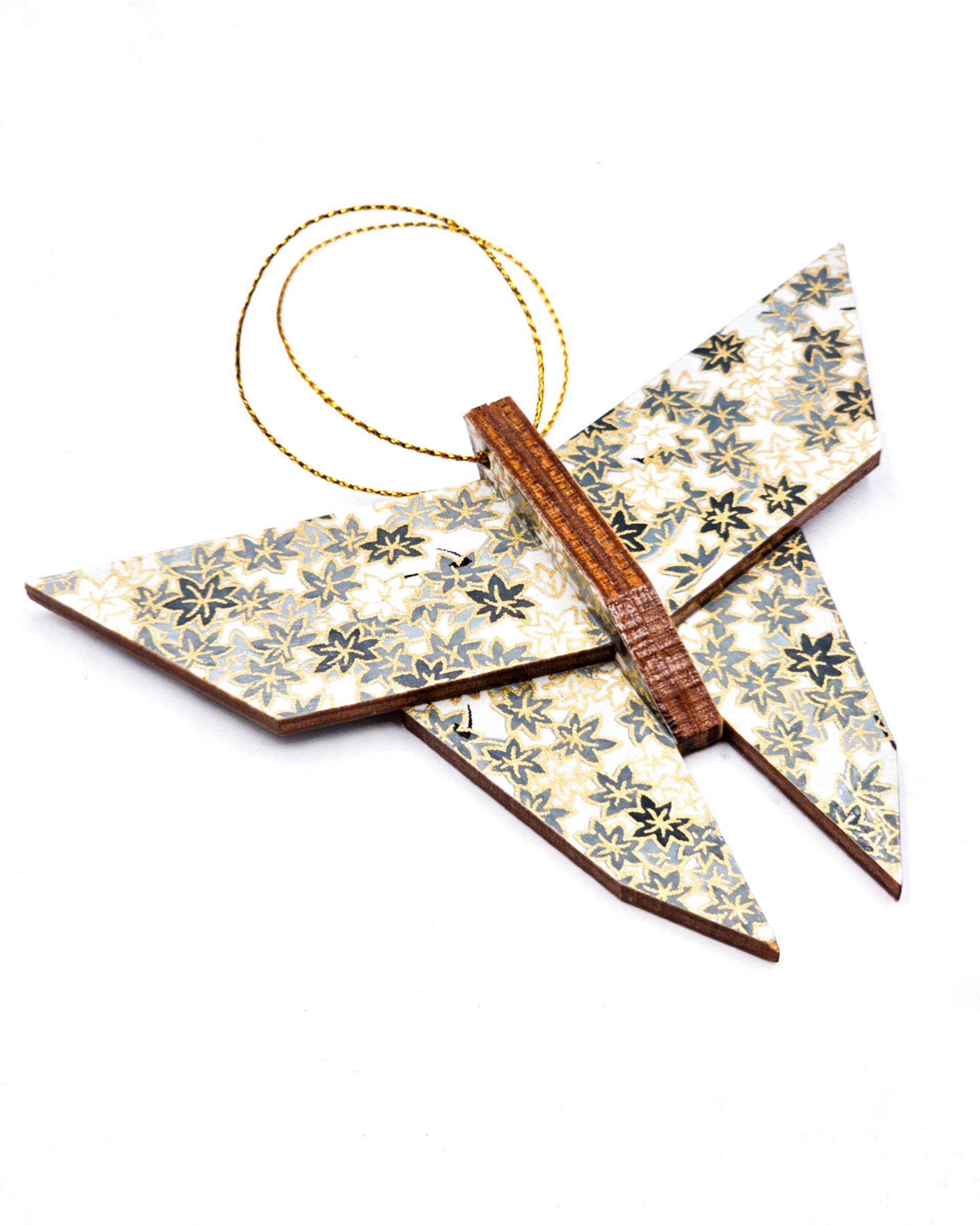 Wooden origami butterfly ornament featuring gray and white maple leaves on a gray background with metallic gold accents.