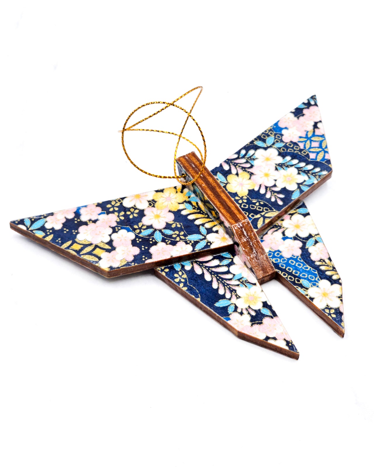 Wooden origami butterfly ornament featuring pink, white, and yellow plum blossoms with pink and blue wisteria on a dark blue background with metallic gold accents.