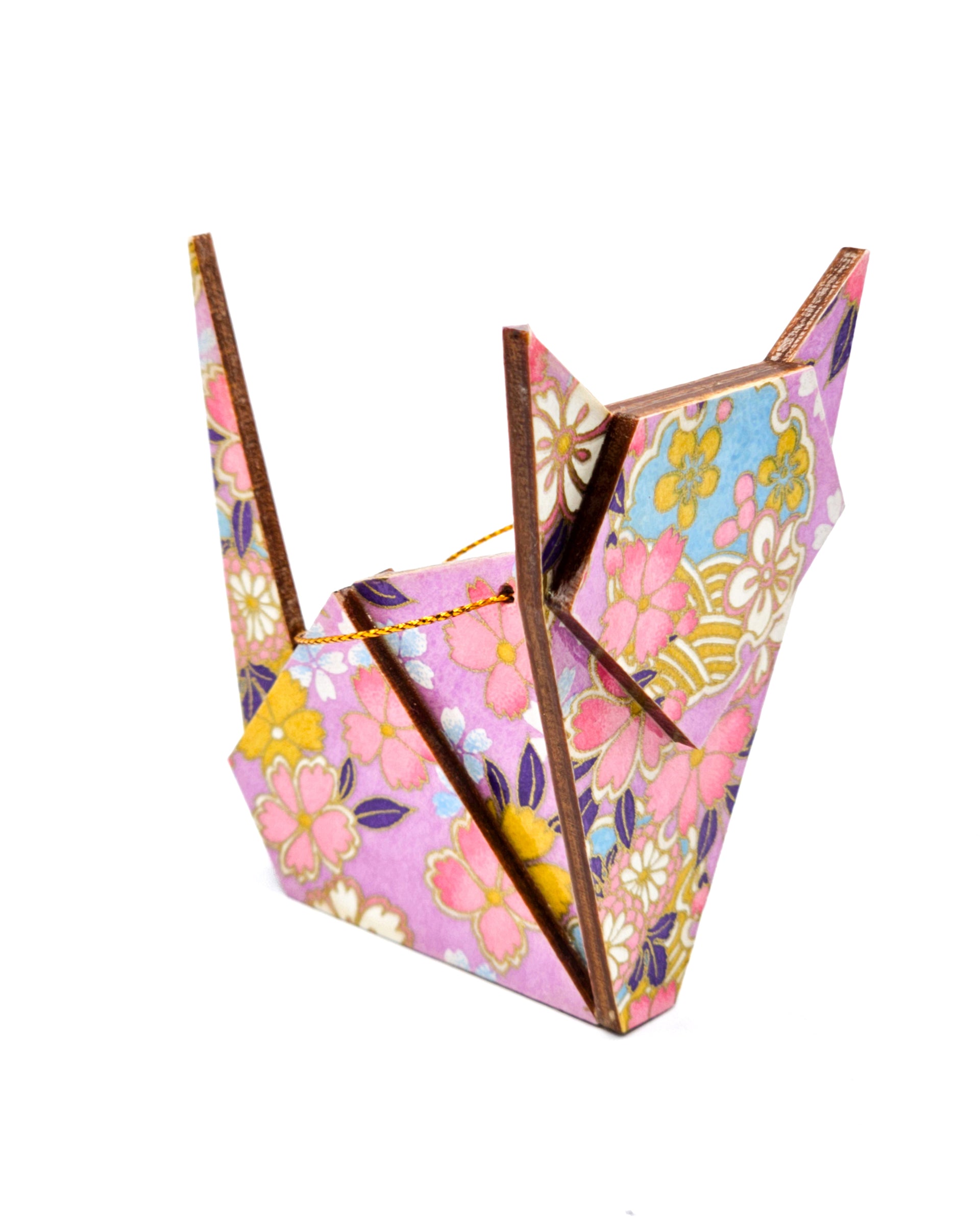 Wooden origami cat ornament featuring pink cherry blossoms and blue yukiwa (snowflakes) on a purple background with metallic gold accents.