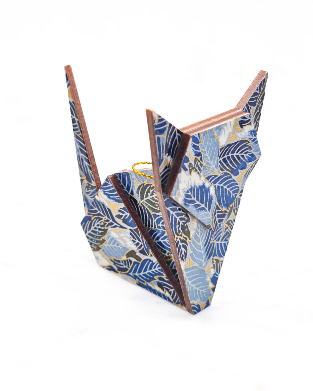 Large wooden origami cat ornament featuring blue, black, and white leaves on a metallic gold background.