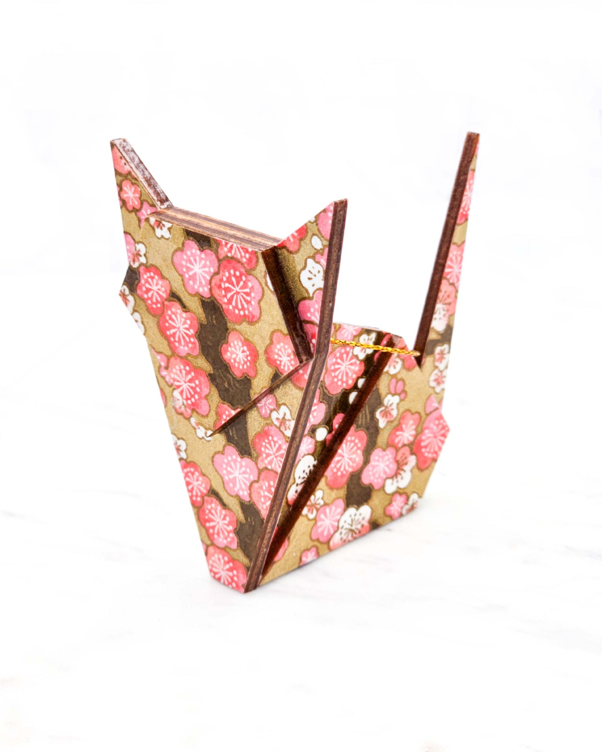 Large wooden origami cat ornament featuring pink and white plum blossoms with brown branches on a metallic gold background.