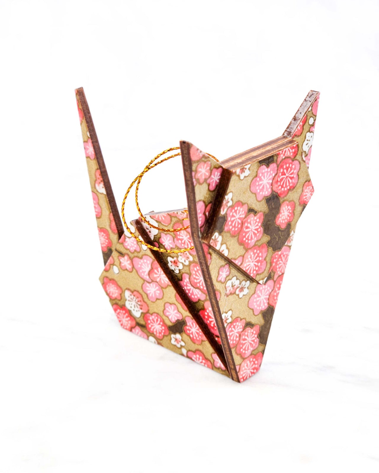 Large wooden origami cat ornament featuring pink and white plum blossoms with brown branches on a metallic gold background.