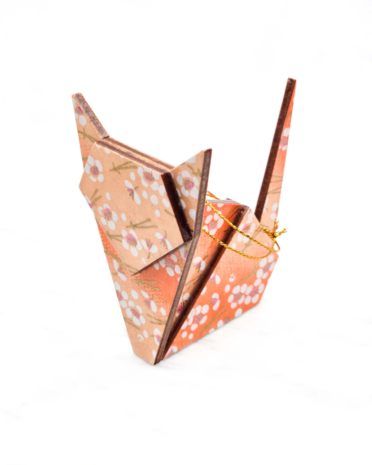 Large wooden origami cat ornament featuring small white plum blossoms and matsuba (pine needles) on an orange gradient background with metallic gold details.