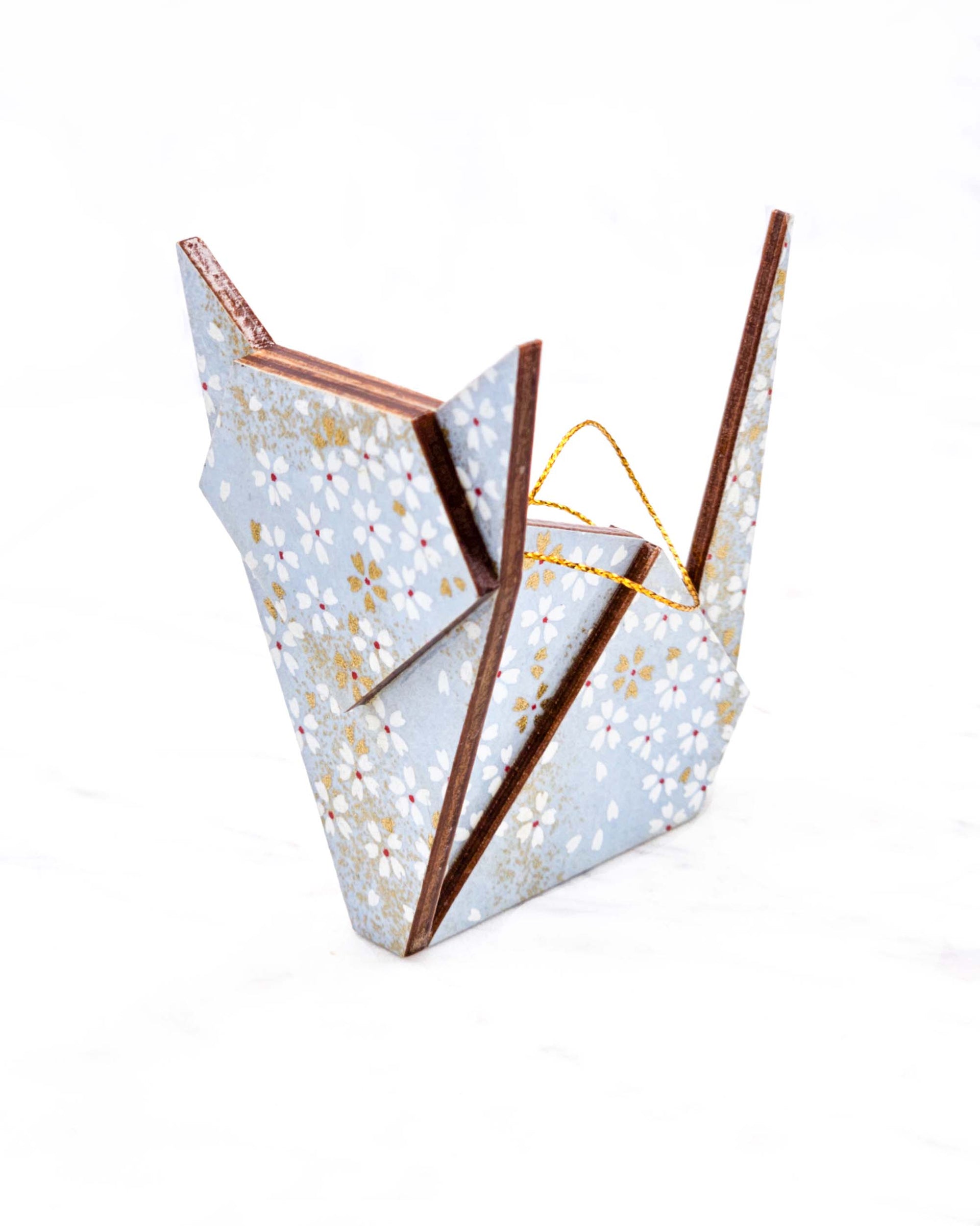 Large wooden origami cat ornament featuring small white and gold cherry blossoms on a light blue background with metallic gold accents.
