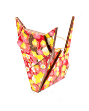 Wooden origami cat ornament featuring pink and yellow plum blossoms on a red background with metallic gold accents.