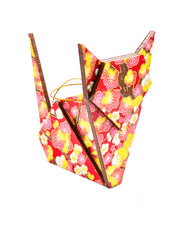 Wooden origami cat ornament featuring pink and yellow plum blossoms on a red background with metallic gold accents.