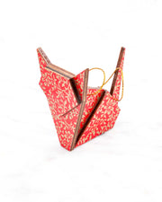 Small wooden origami cat ornament featuring a metallic gold floral motif on a bright red background.