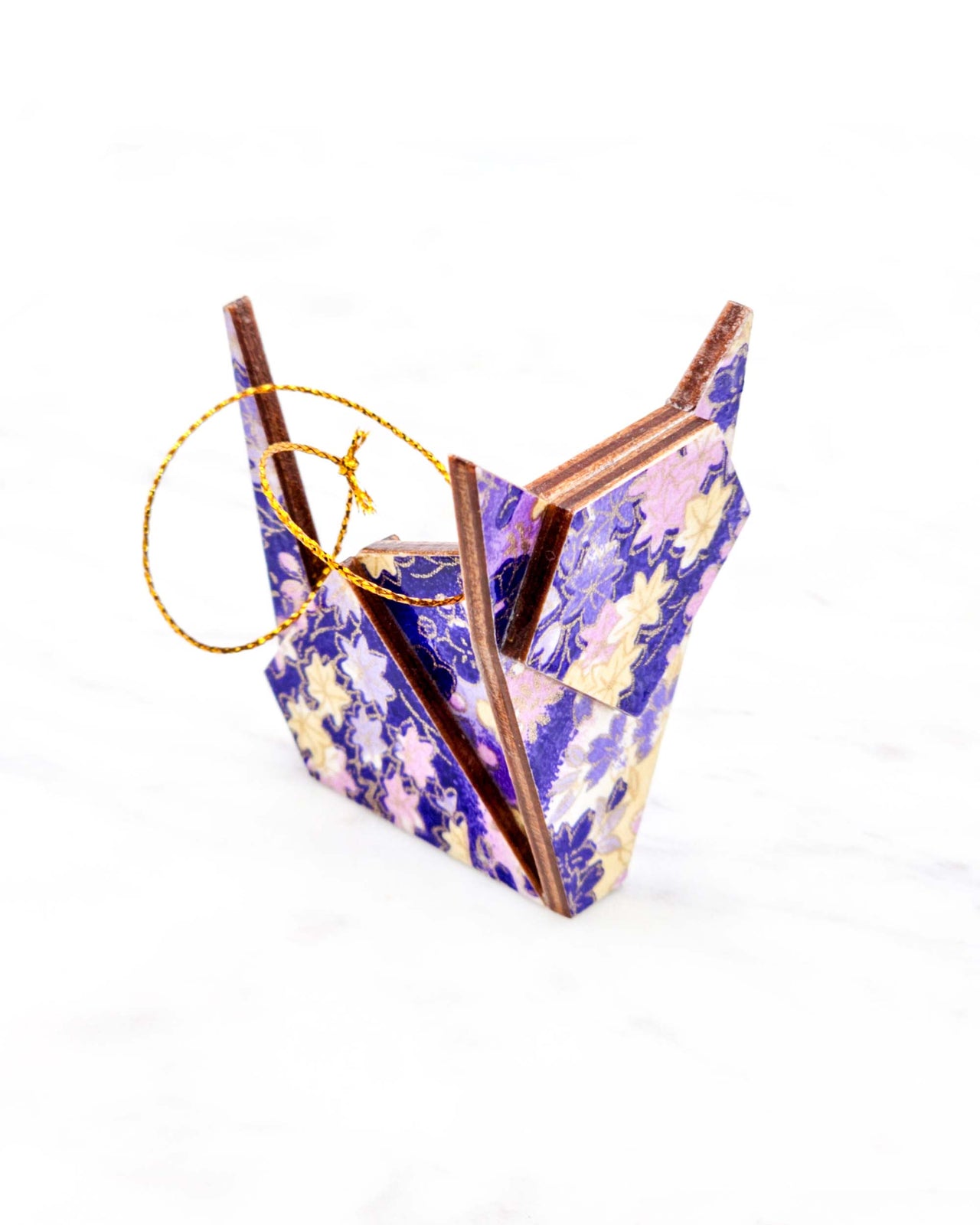 Small wooden origami cat ornament featuring purple and yellow flowers and maple leaves on a purple and white background with metallic gold details.