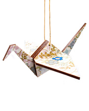 Wooden origami crane ornament featuring blue and silver cherry blossoms and blue and purple ichimatsu pattern on a white background with metallic gold accents.