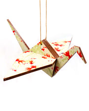 Wooden origami crane ornament featuring red and white koi fishes on a green background.