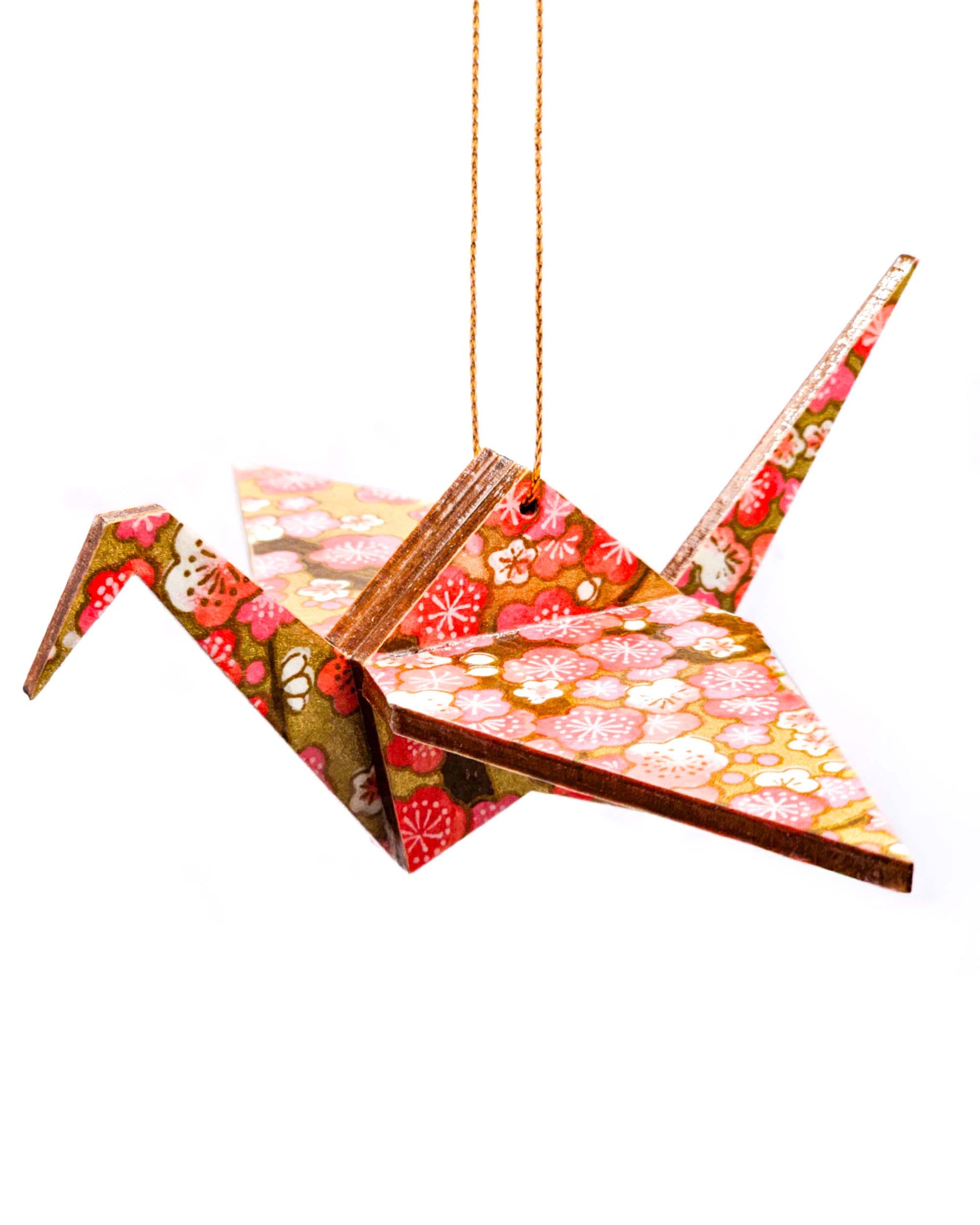 Wooden origami crane ornament featuring pink plum blossoms on metallic gold background.