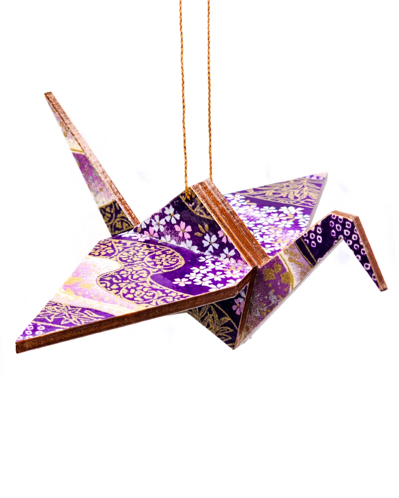 Wooden origami crane ornament featuring small purple and white cherry blossoms on a purple and white background with metallic gold accents.