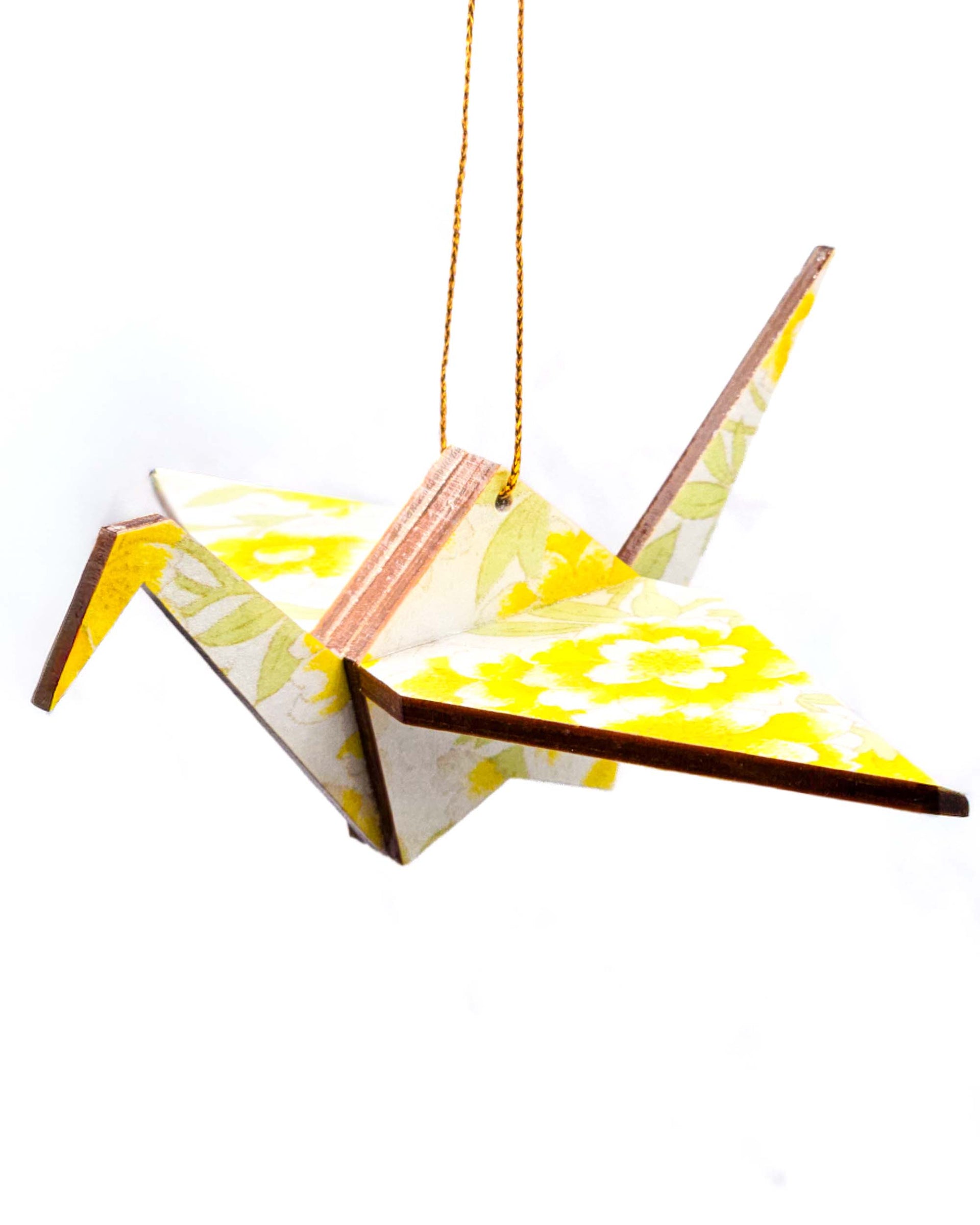 Wooden origami crane ornament featuring yellow flowers on a pearlescent white background with metallic gold accents.