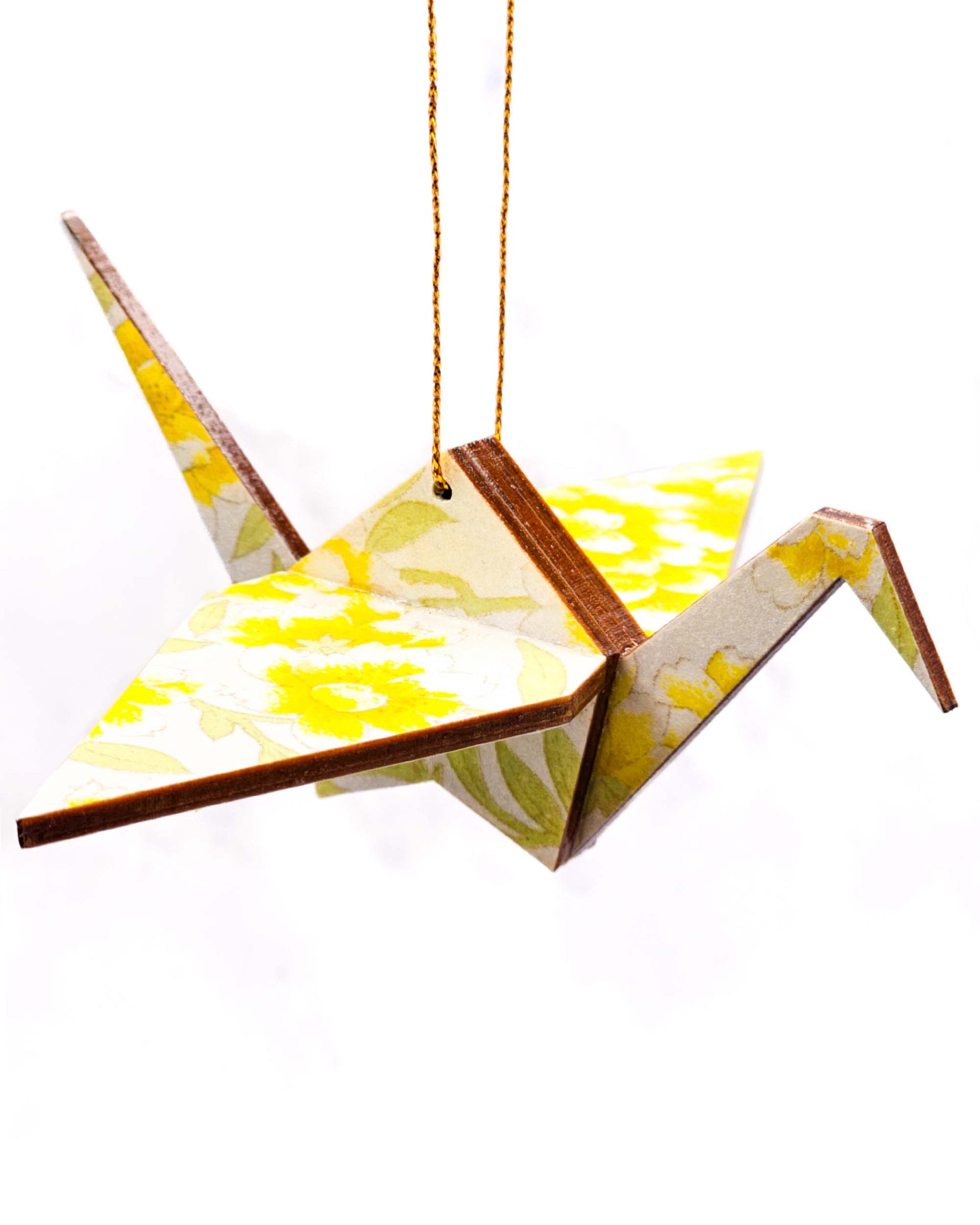 Wooden origami crane ornament featuring yellow flowers on a pearlescent white background with metallic gold accents.