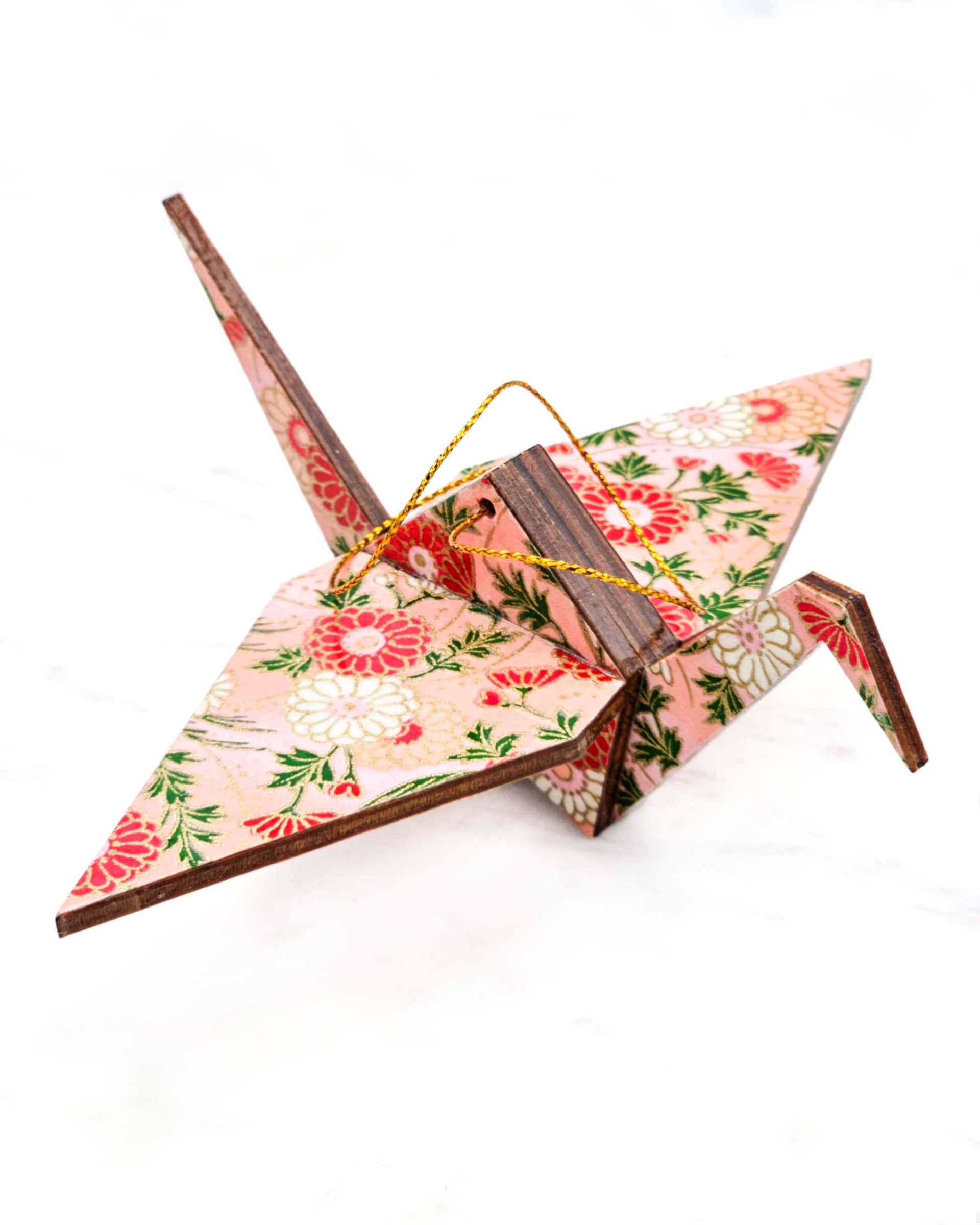 Large wooden origami crane ornament featuring pink, white, and red chrysanthemums with green leaves on a pink background with metallic gold accents.