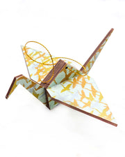 Large wooden origami crane ornament featuring small flying gold and silver cranes on a turquoise background with metallic gold details.