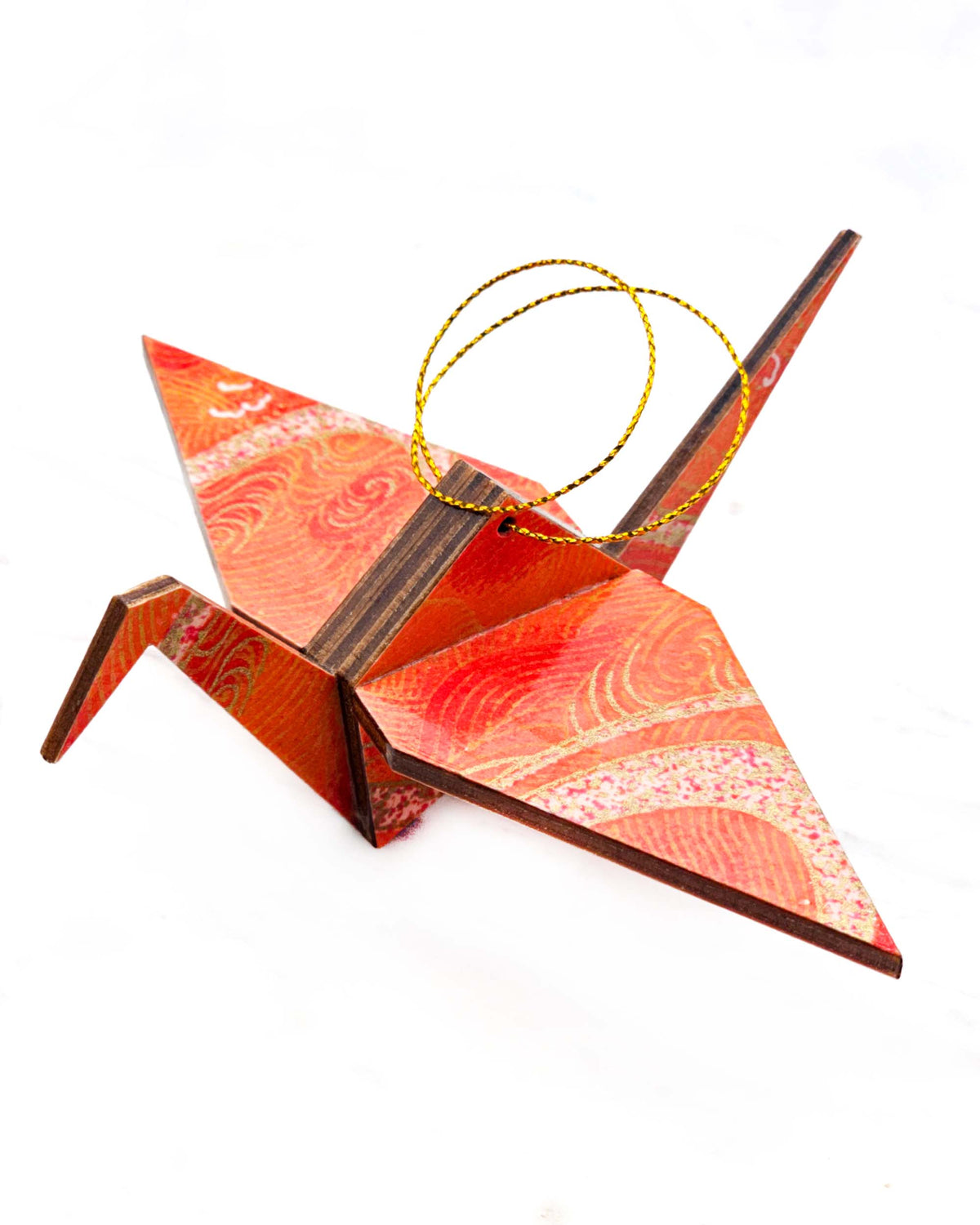 Large wooden origami crane ornament featuring orange swirls with metallic gold details.