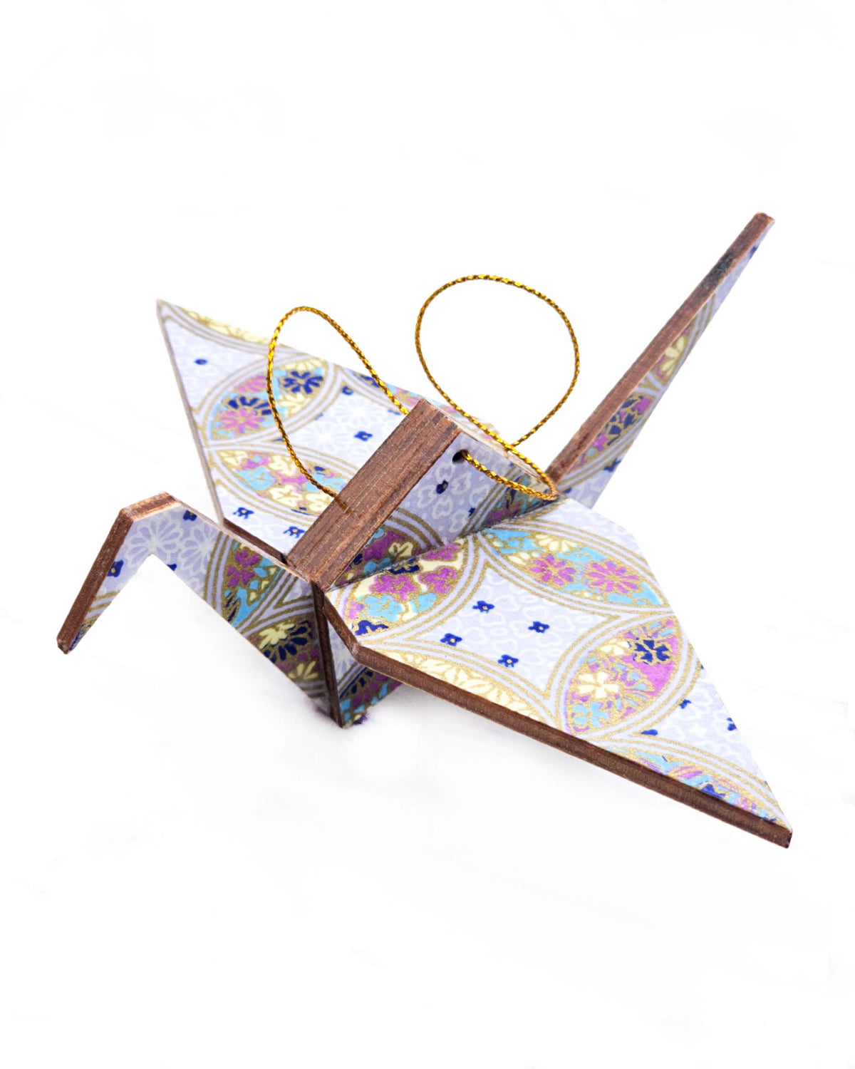 Large wooden origami crane ornament featuring a blue, yellow, and purple shippo design filled with assorted floral and geometric designs on a light purple background with metallic gold details.
