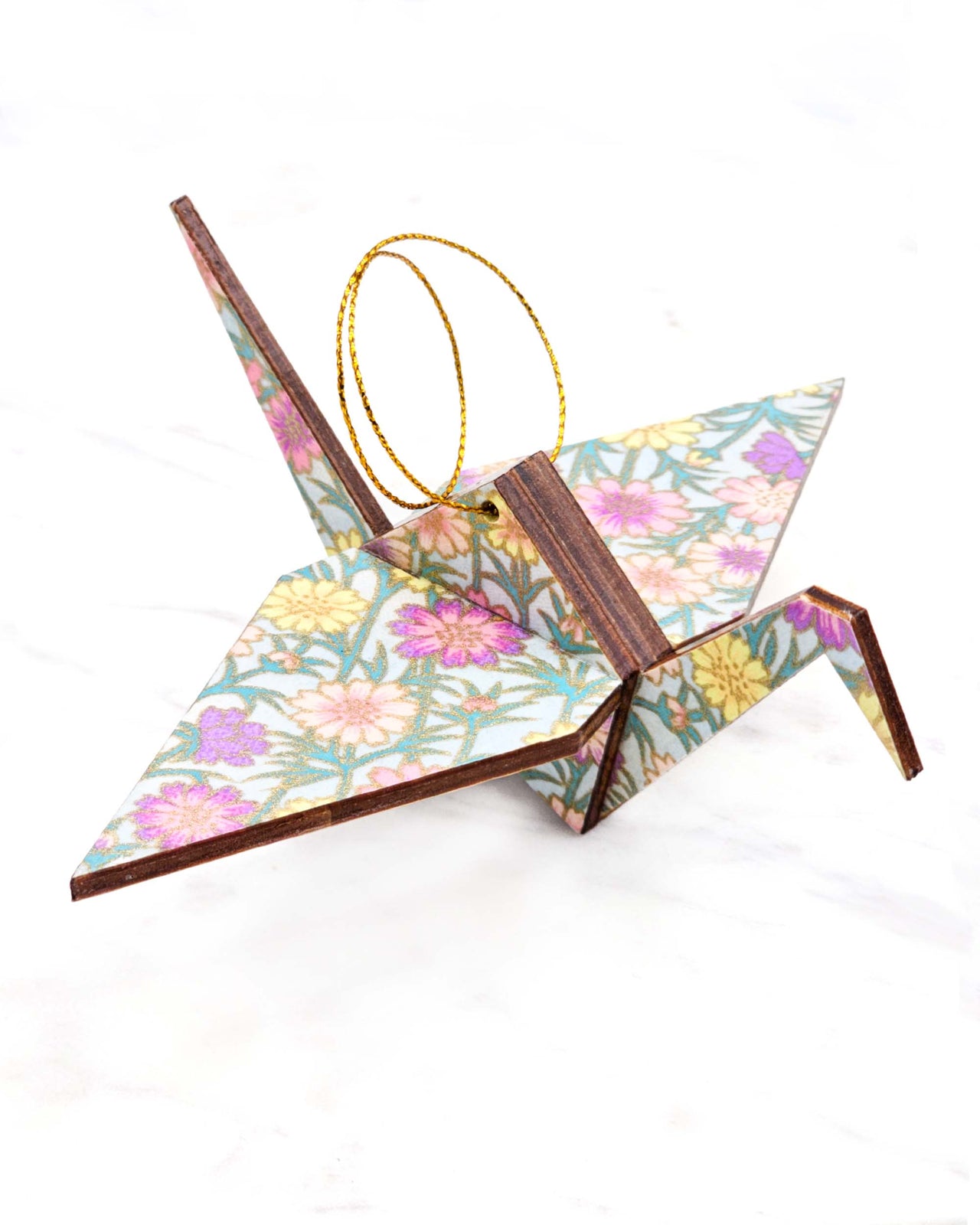 Large wooden origami crane ornament featuring a red, pink, and purple shippo design filled with assorted floral and geometric designs with metallic gold details. The centers of the shippos features assorted white floral outlines.