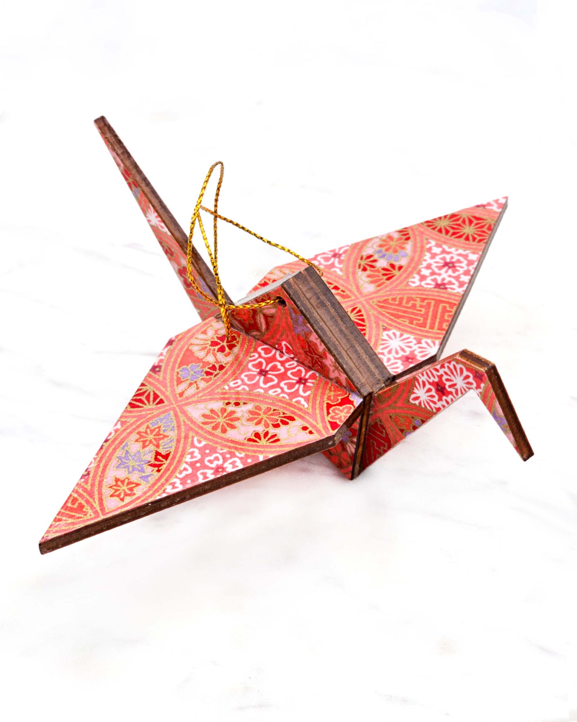 Large wooden origami crane ornament featuring a red, pink, and purple shippo design filled with assorted floral and geometric designs with metallic gold details. The centers of the shippos features assorted white floral outlines.