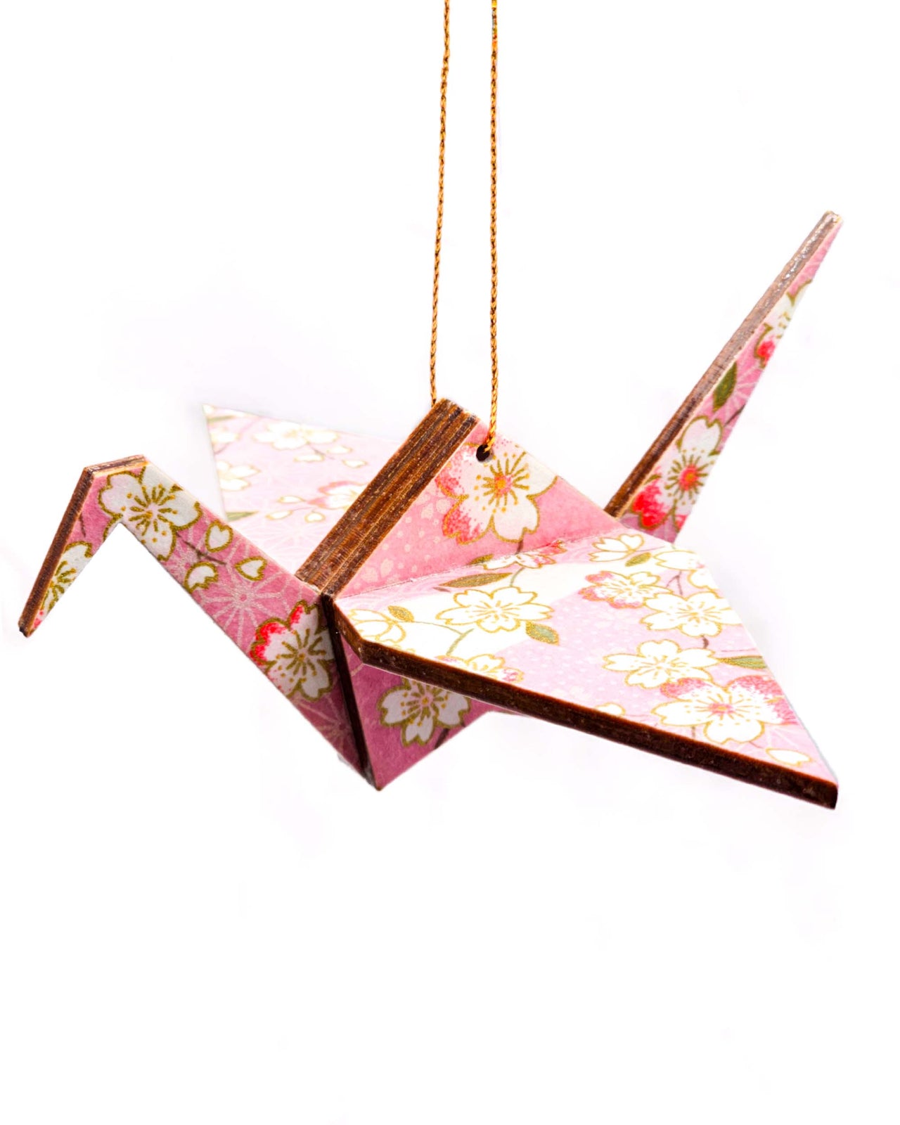 Wooden origami crane ornament featuring pink and white cherry blossoms on a light pink background with metallic gold accents.