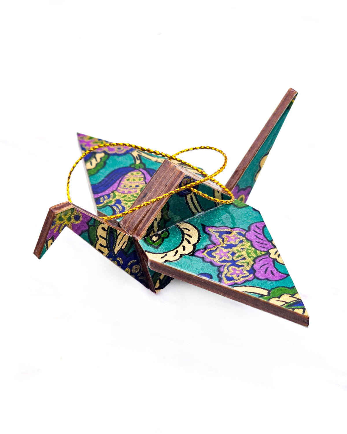Small wooden origami crane ornament featuring purple and blue sarasa flowers on a pearlescent green background with metallic gold details.