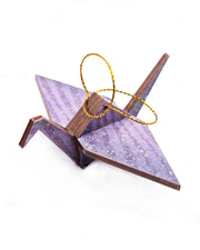 Small wooden origami crane ornament featuring gradient purple swirls with metallic gold and silver details.