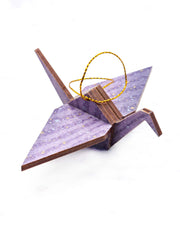 Small wooden origami crane ornament featuring gradient purple swirls with metallic gold and silver details.
