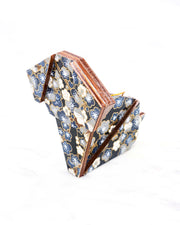 Large wooden origami dog ornament featuring blue and gray plum blossom trees with brown branches on a dark blue background with metallic gold details.
